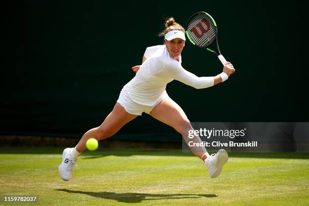 Madison Brengle of The United States plays a backhand in her Ladies' Singles second round match against Karolina Muchova of The Czech Republic during...