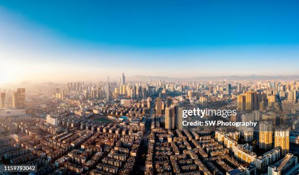 sunset view and cityscape of kunming, yunnan, china - kunming stock pictures, royalty-free photos & images