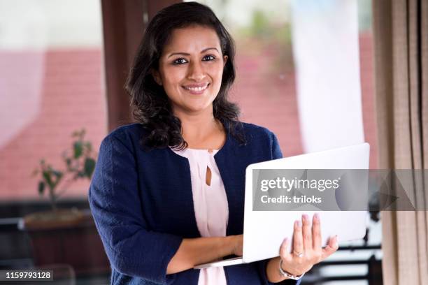 businesswoman using laptop - indian women stock pictures, royalty-free photos & images