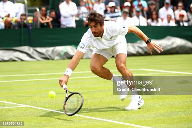 Pablo Cuevas of Uruguay plays a backhand in his Men's Singles second round match against Jiri Vesely of Czech Republic during Day three of The...