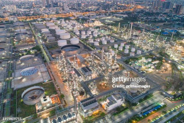 aerial view of oil refinery and gas industry in petrochemical plant at twilight - saudi arabia industry stock pictures, royalty-free photos & images