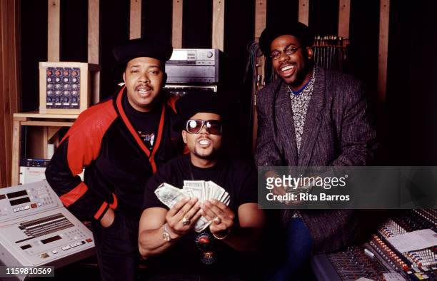 Portrait of American Rap group Run-DMC as they pose in a recording studio, New York, April 26, 1990. Pictured are, from left, DJ Run , DMC and Jam...