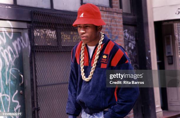 View of American rapper LL Cool J as he stands outdoors, New York, April 23, 1990.