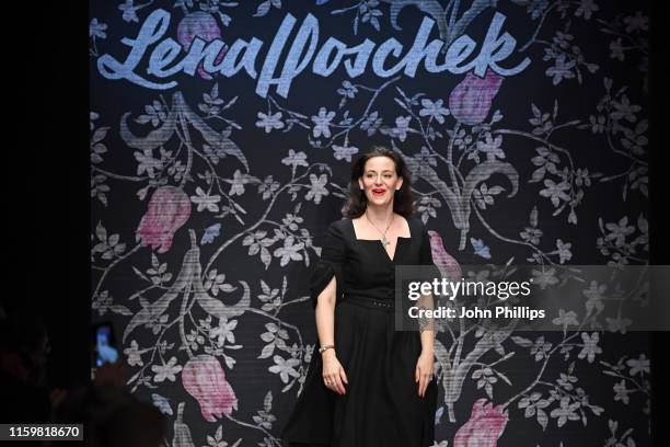 Designer Lena Hoschek acknowledges the applause of the audience after her show during the Berlin Fashion Week Spring/Summer 2020 at ewerk on July 03,...