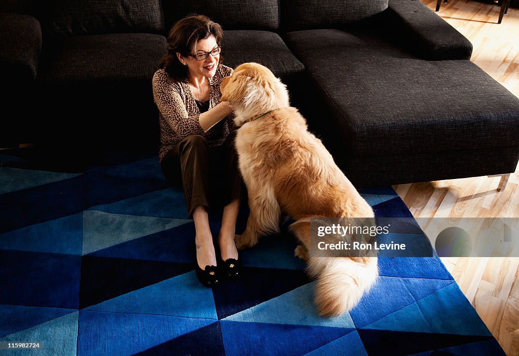 Mature woman cuddling her dog