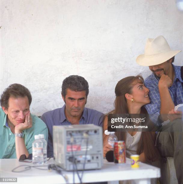 Actor Saul Lizaso watches TV with producer Carlos Sotomayor, actress Kate del Castillo and director Sergio Catano taken in August 2000 in Cuernavaca,...