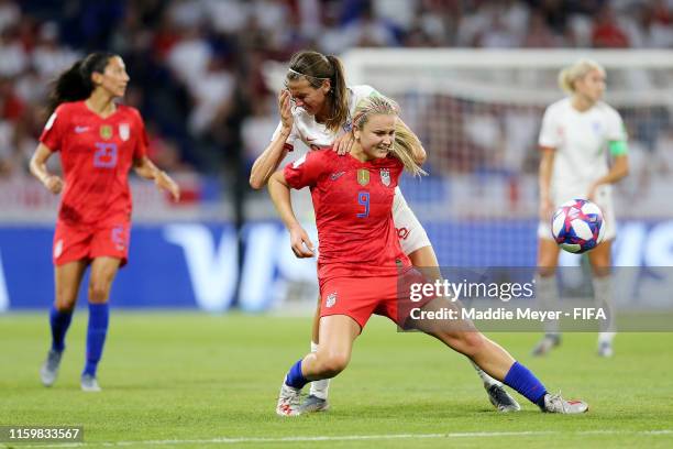 Lindsey Horan of the USA shields the ball from Jill Scott of England during the 2019 FIFA Women's World Cup France Semi Final match between England...