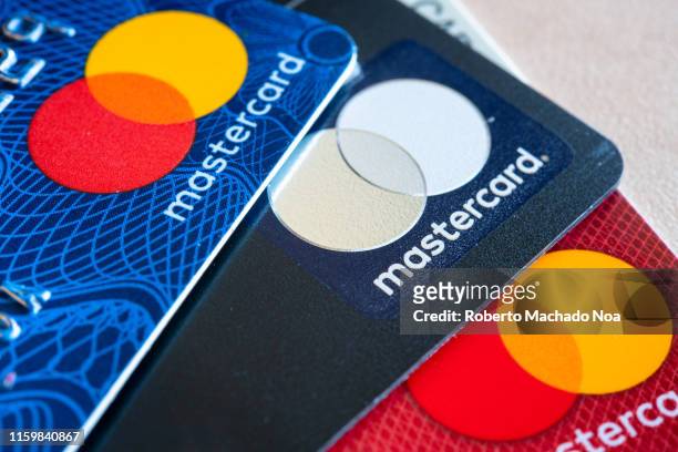 In this photo illustration there are three Mastercard Credit Cards. The branding and marketing logo of a financial company. Business related...