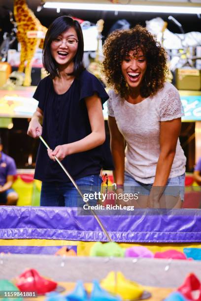 summer fun carnival games - multicultural gala an evening of many cultures stock pictures, royalty-free photos & images