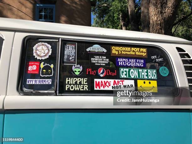 santa fe, nm: vintage vw van covered with bumper stickers - bumper sticker stock pictures, royalty-free photos & images