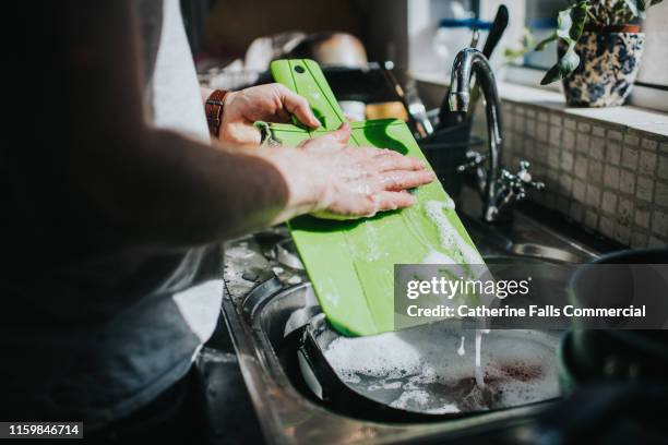 washing dishes - food borne illness stock pictures, royalty-free photos & images