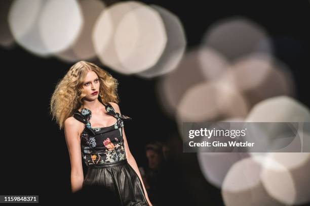 Model walks the runway at the Lena Hoschek show during the Berlin Fashion Week Spring/Summer 2020 at ewerk on July 03, 2019 in Berlin, Germany.