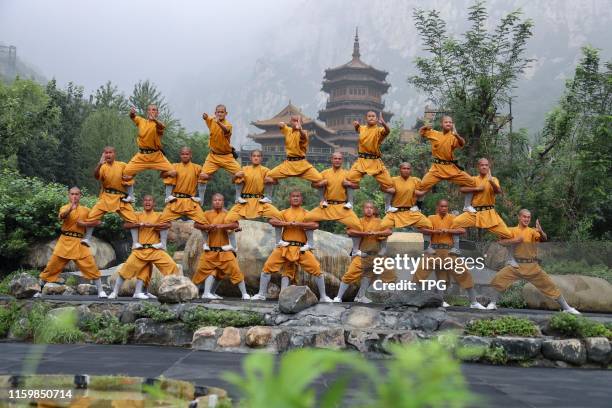 The young men are practicing Shaolin Kung Fu on 04th August, 2019 in Dengfeng,Henan,China.