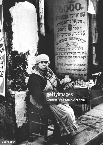Portrait of a female street vendor in the Jewish quarter, Paris, France, 1935.
