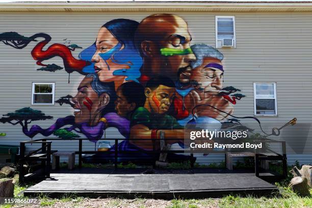 Mural by Max Sansing is displayed at the Sweet Water Foundation's Think-Do House in the Englewood neighborhood in Chicago, Illinois on July 1, 2019....