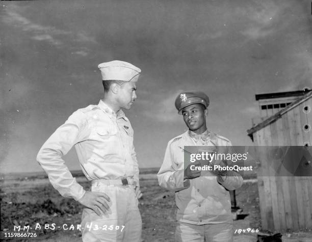 Commanding Officer of the 99th Fighter Squadron Lt Col Benjamin O Davis Jr speaks with war correspondent Ollie Stewart , Fez, French Morocco, May 12,...