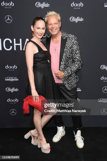 Christin Dechant and Uwe Fahrenkrog-Petersen attend the Atelier Michalsky show during the Berlin Fashion Week Spring/Summer 2020 at ewerk on July 03,...