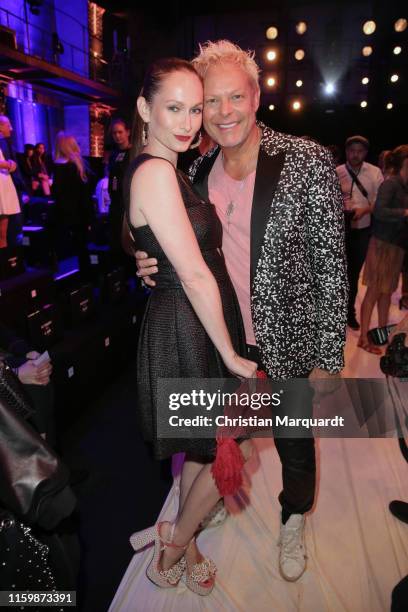 Christin Dechant and Uwe Fahrenkrog-Petersen attend the Atelier Michalsky show during the Berlin Fashion Week Spring/Summer 2020 at ewerk on July 03,...