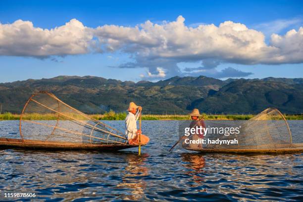 fishermen on inle lake, myanmar - intha fisherman stock pictures, royalty-free photos & images