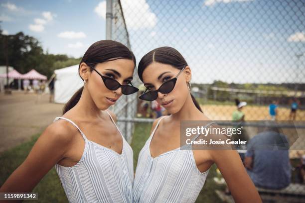 Identical twin sisters attend the Twins Days Festival at Glenn Chamberlin Park on August 4, 2019 in Twinsburg, Ohio. Twins Day celebrates biological...