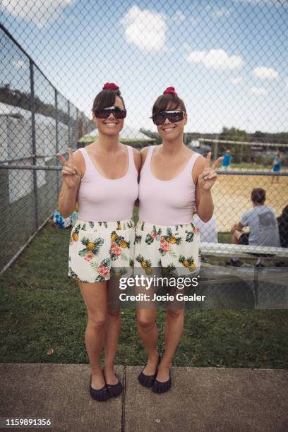 Identical twin sisters attend the Twins Days Festival at Glenn Chamberlin Park on August 4, 2019 in Twinsburg, Ohio. Twins Day celebrates biological...