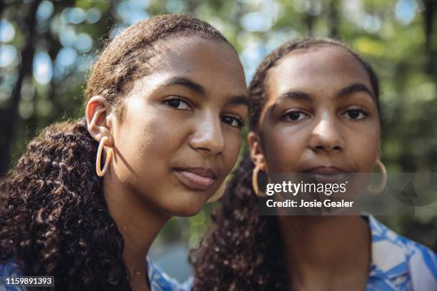 Identical twin sisters attend the Twins Days Festival at Glenn Chamberlin Park on August 4, 2019 in Twinsburg, Ohio. Twins Day celebrates biological...