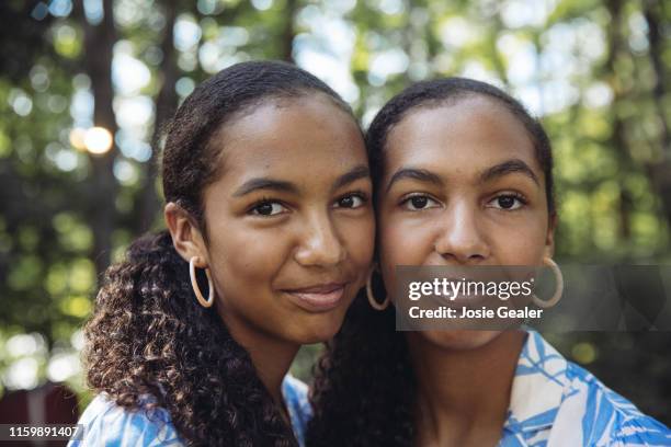 Identical twin sisters attend the Twins Days Festival at Glenn Chamberlin Park on August 4, 2019 in Twinsburg, Ohio. Twins Day celebrates biological...