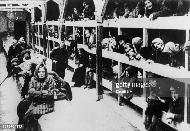Women are pictured in their barrack after the liberation in January 1945 of the Oswiecim concentration camp. The Auschwitz camp was established by...
