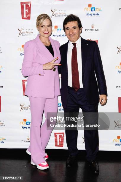 Simona Ventura and Urbano Cairo attend the F Magazine Party at Filippo La Mantia Oste e Cuoco restaurant on July 03, 2019 in Milan, Italy.