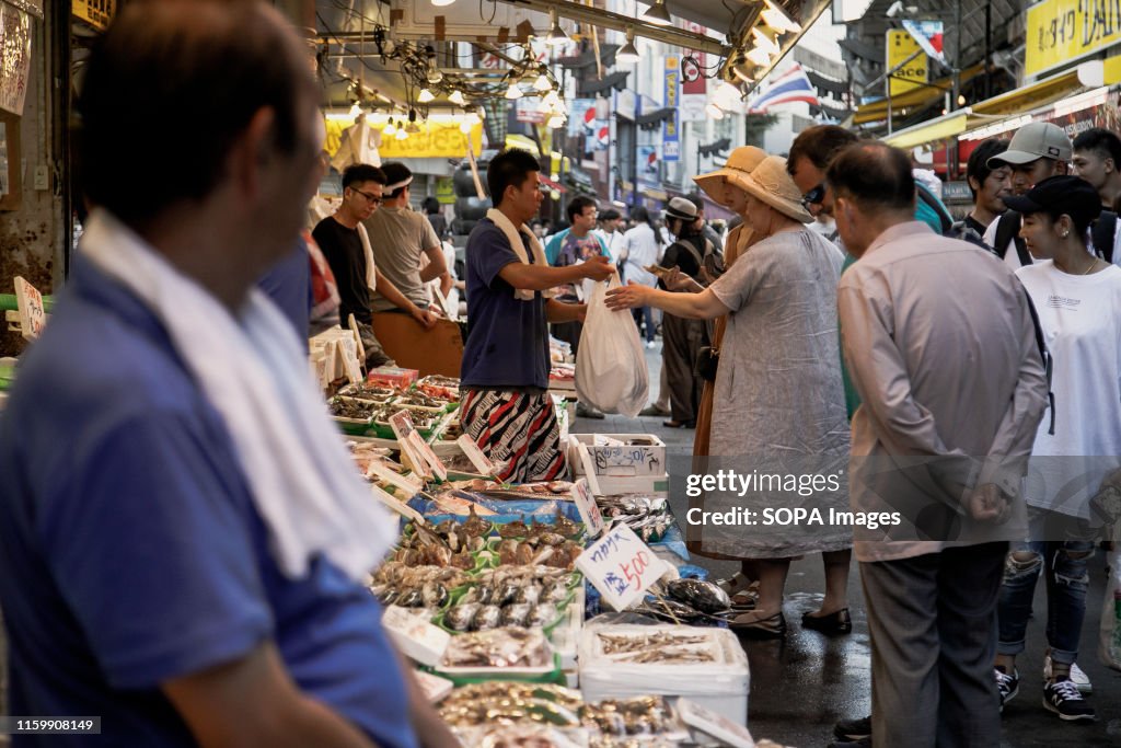People shopping for fresh fish at  the Ameya Yokocho market...