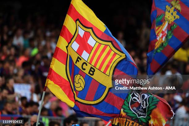 Fans of FC Barcelona wave flags during the Pre-Season Friendly between FC Barcelona and Arsenal at Nou Camp on August 4, 2019 in Barcelona, Spain.