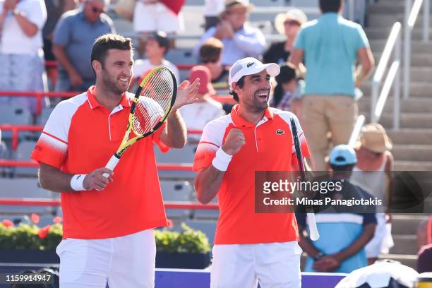 Jeremy Chardy and Fabrice Martin of France celebrate their 6-7, 5-7 victory over Felix Auger-Aliassime and Vasek Pospisil of Canada during day 4 of...