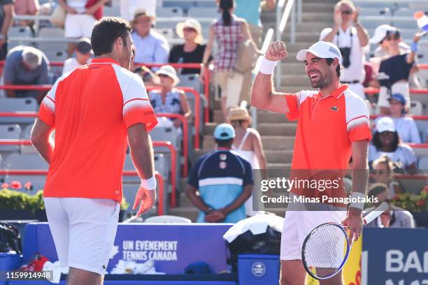 Jeremy Chardy and Fabrice Martin of France celebrate their 6-7, 5-7 victory over Felix Auger-Aliassime and Vasek Pospisil of Canada during day 4 of...