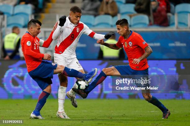 Paolo Guerrero of Peru fights for the ball with Gary Medel and Erick Pulgar of Chile during the Copa America Brazil 2019 Semi Final match between...