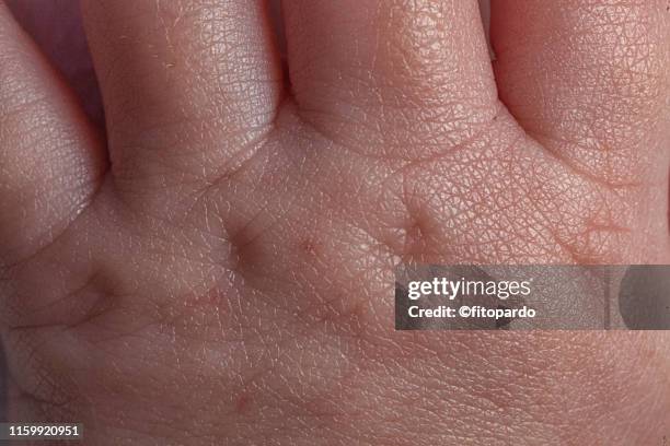 close up of a baby hand in macro - extreme close up baby stock pictures, royalty-free photos & images