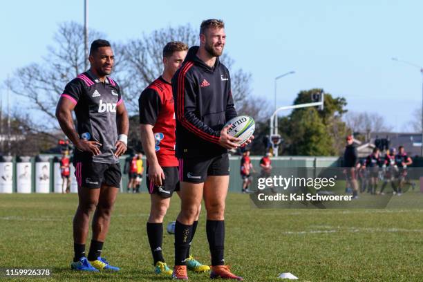 Sevu Reece, Brett Cameron and Braydon Ennor look on during a Crusaders Super Rugby training session at Rugby Park on July 04, 2019 in Christchurch,...