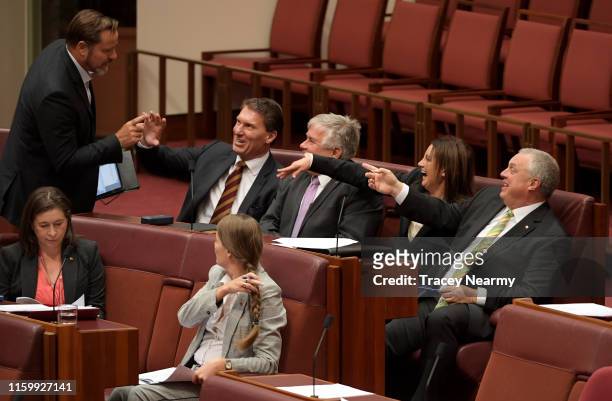 Senator Jacqui Lambie sits with Senator Stirling Griff , Senator Rex Patrick and Senator Corey Bernardi shoo away Senator Peter Whish-Wilson during a...
