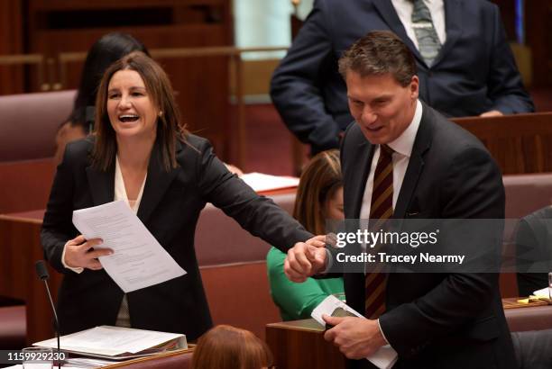 Senator Jacqui Lambie laughs with Senator Corey Bernardi during a division in the Senate at Parliament House on July 04, 2019 in Canberra, Australia....