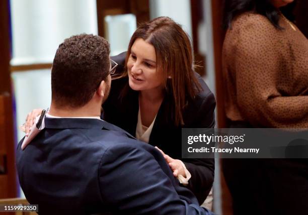 Senator Jacqui Lambie laughs with Senator Jordan Steele-John during a division in the Senate at Parliament House on July 04, 2019 in Canberra,...