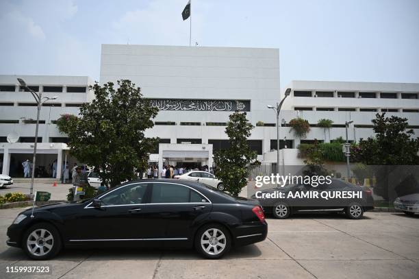 Vehicle carrying the president of Pakistan-administered Kashmir Masood Khan arrives to attends joint Parliament session in Islamabad on August 6 a...