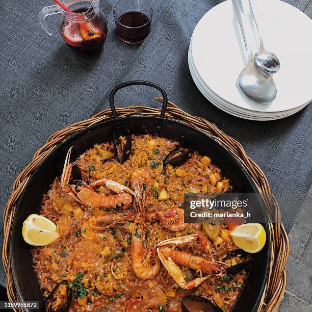 summer in costa brava - paella stock-fotos und bilder