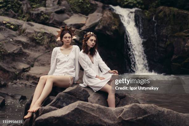 young lake nymphs enjoying the silence - forest nymph stock pictures, royalty-free photos & images