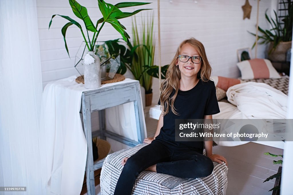 Cheerful 9-10 years old girl caucasian wearing glasses with long blonde hair