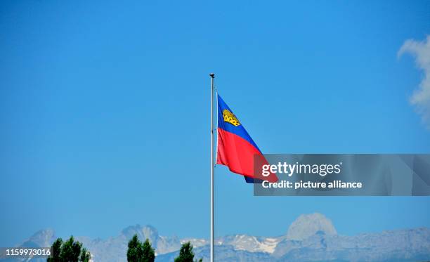 July 2019, Liechtenstein, Vaduz: The national flag of Liechtenstein - The Principality of Liechtenstein is 300 years old. It was founded on 15 August...