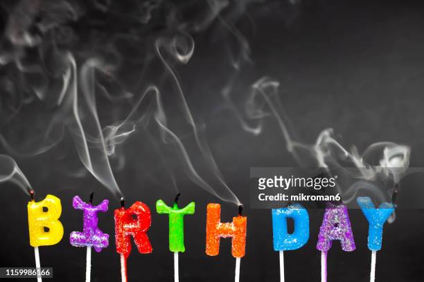 birthday candles blown out. - birthday candle on black stock pictures, royalty-free photos & images