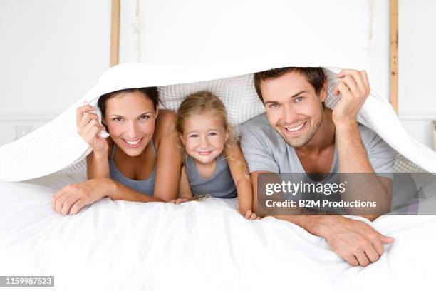 portrait of family under bed cover - 2010 2019 bildbanksfoton och bilder