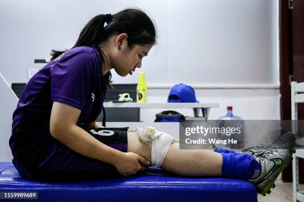 Ouyang Nianchi 22. She sprained his knee and put it on ice at starry sky stadium on July 3.2019 in WuhanHubei Province.China. She comes from Dawu....