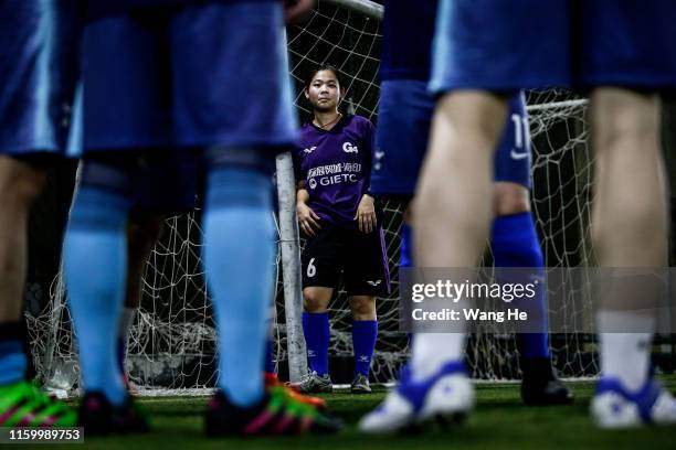 Ouyang Nianchi 22. She is playing football with mens at starry sky stadium on July 3.2019 in WuhanHubei Province.China. She comes from Dawu. It's...