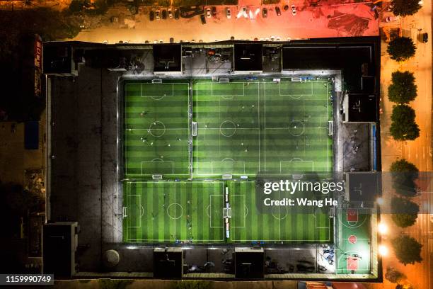The view of starry sky stadium at market on the roof are seen from an aircraft. Ouyang Nianchi and mens play football here field on July 3.2019 in...