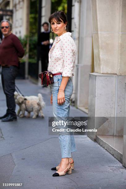 Carlotta Rubaltelli, wearing a Valentino shirt, light blue jeans, burgundy fannypack and cream and black heels, is seen outside Christian Dior show...